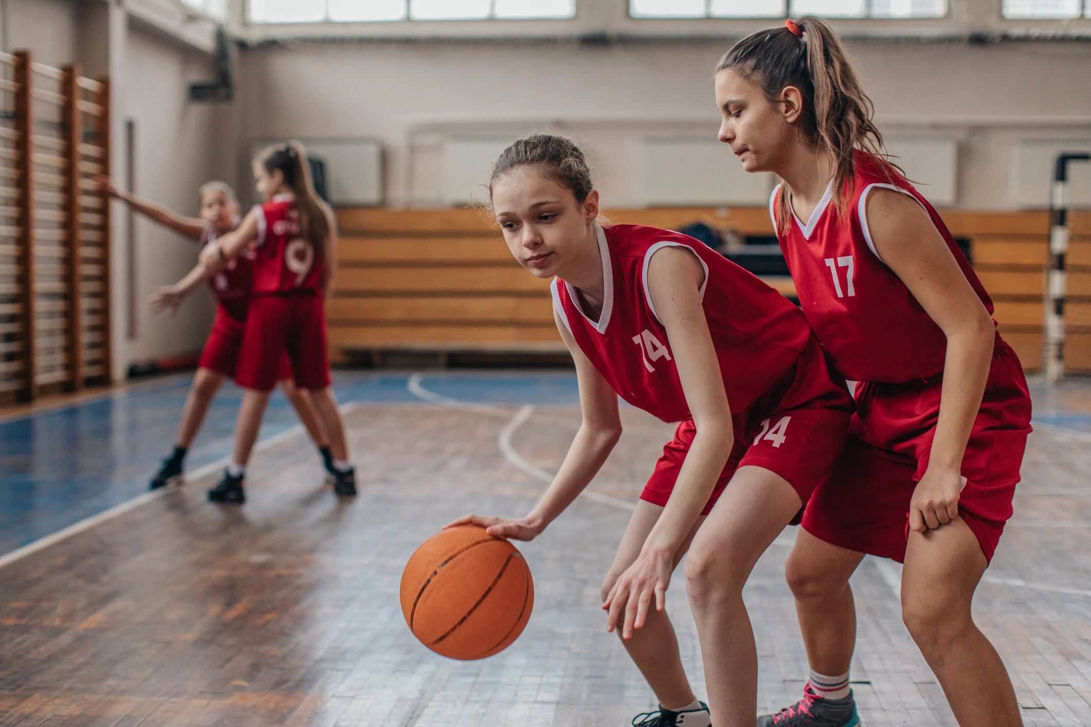 Girls practicing basketball together
