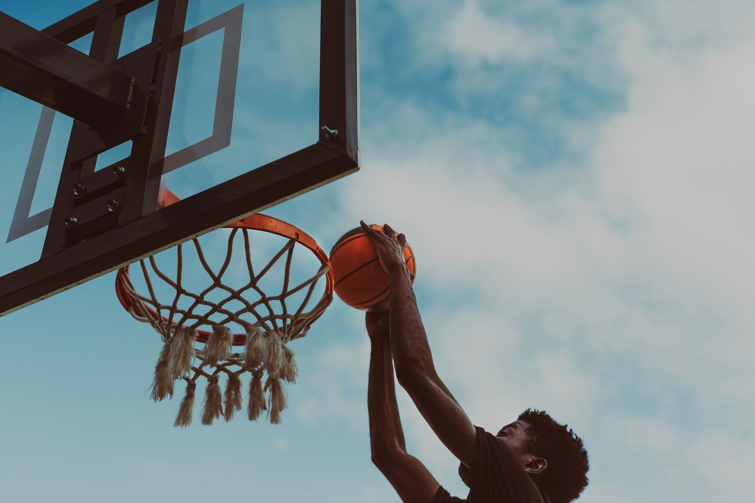 Young player shooting outdoors