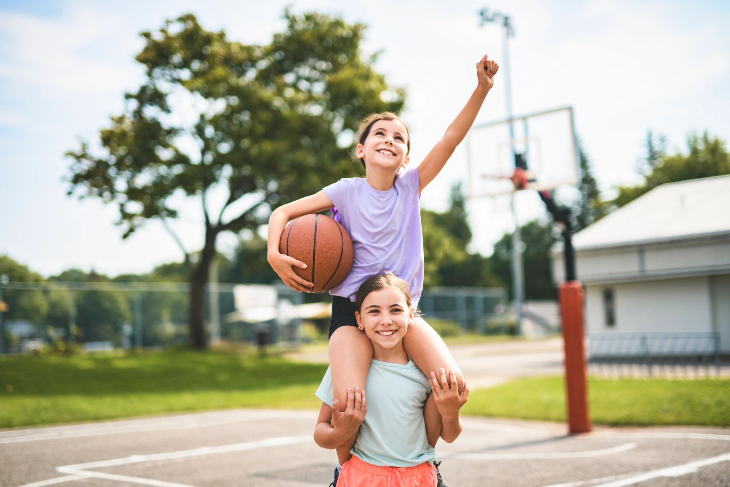 Children playing basketball and having fun