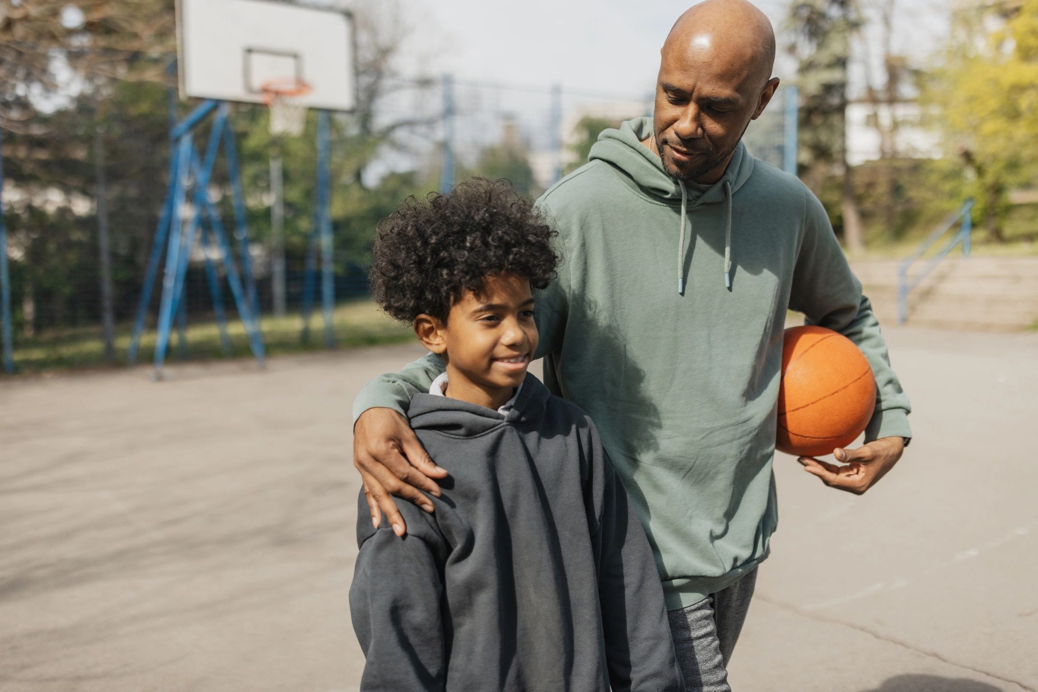 Coach Mike giving advice to a young player
